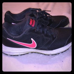 Black Nikes. Pink swoosh.